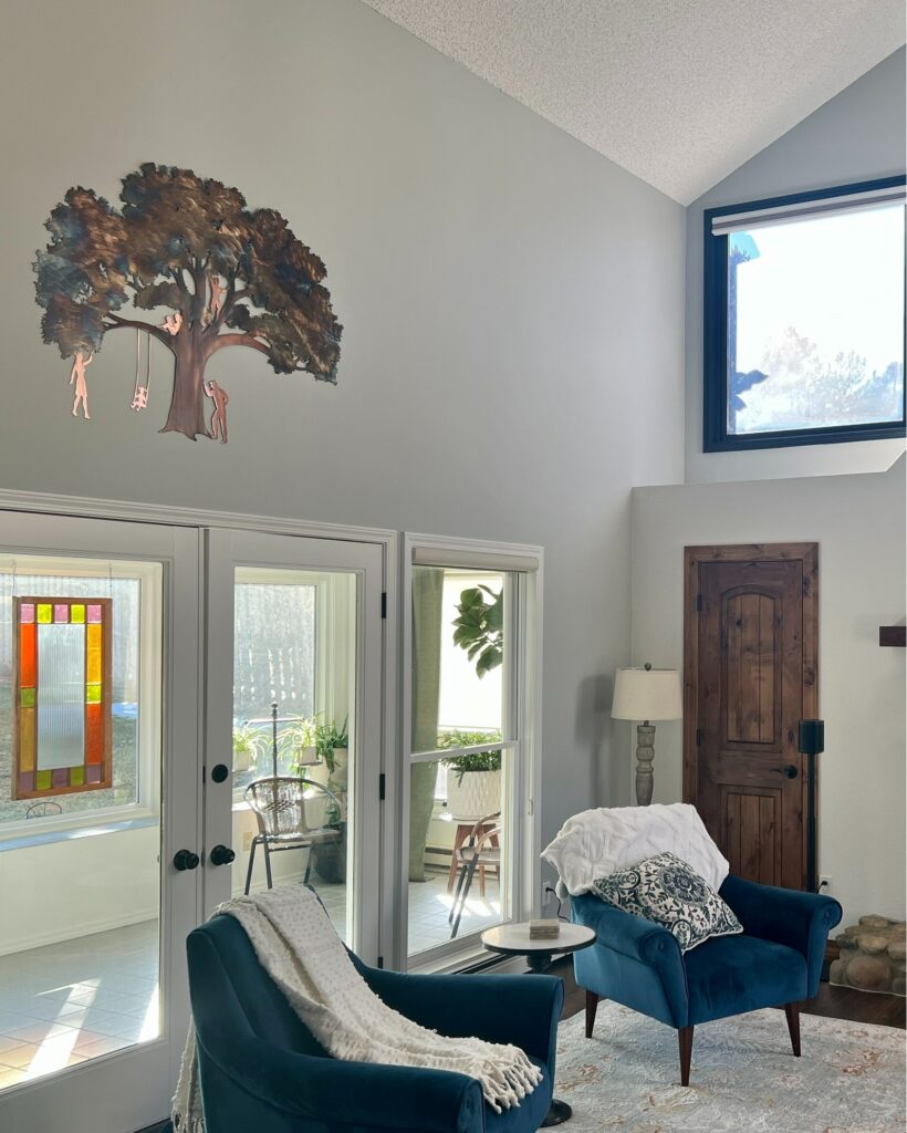Tree-shaped metal wall art in a living room