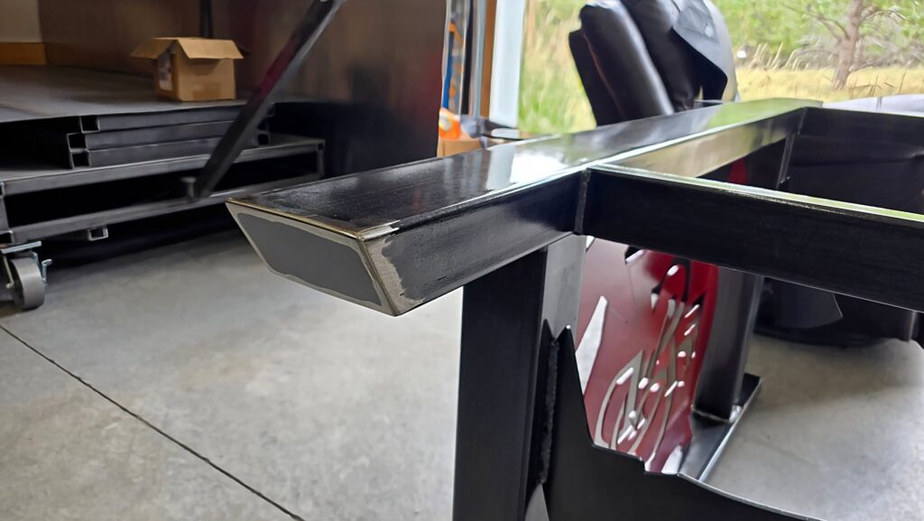 Clear powder-coated steel table frame